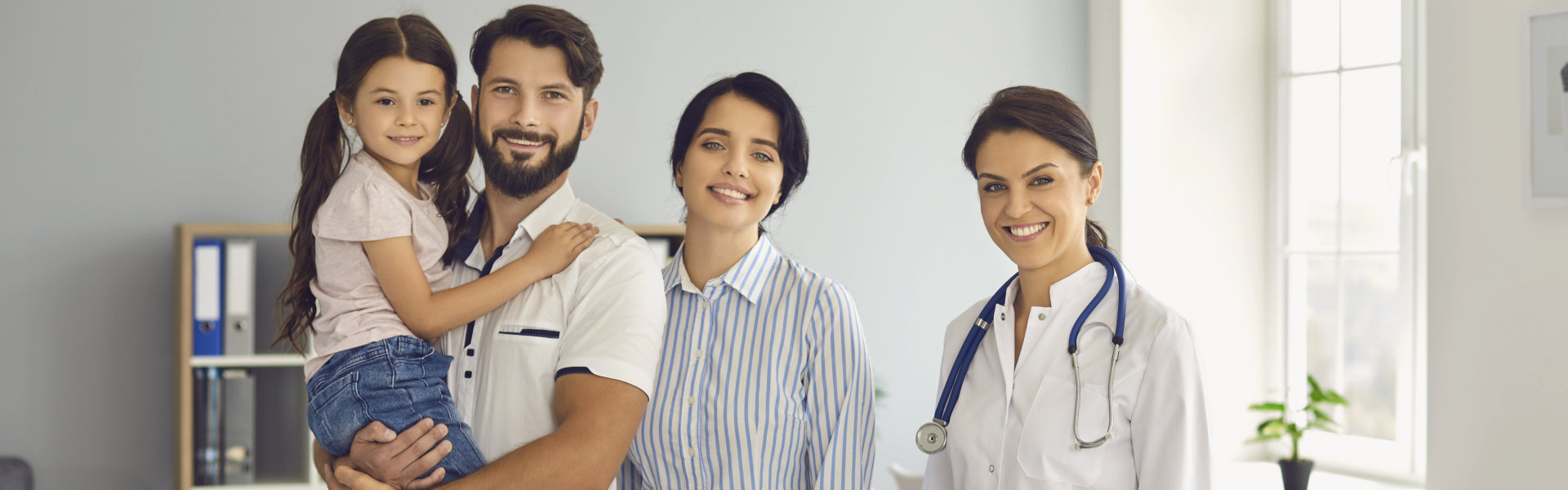 family at a doctor`s consultation at the clinic