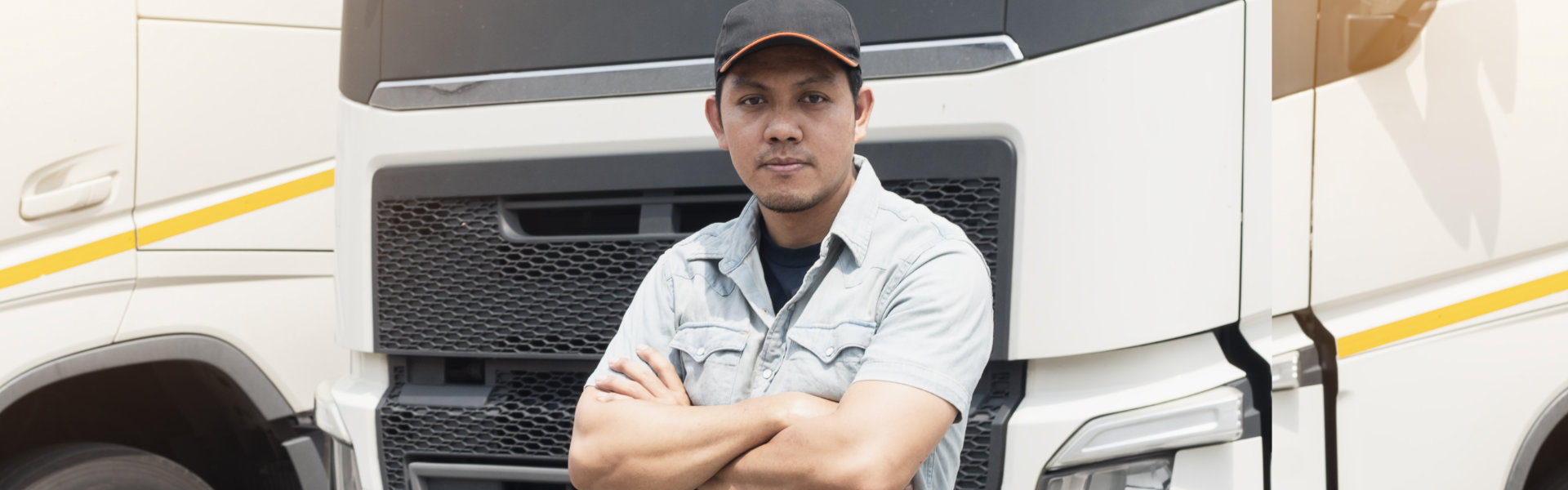 truck driver standing cross one’s arm looking with smile