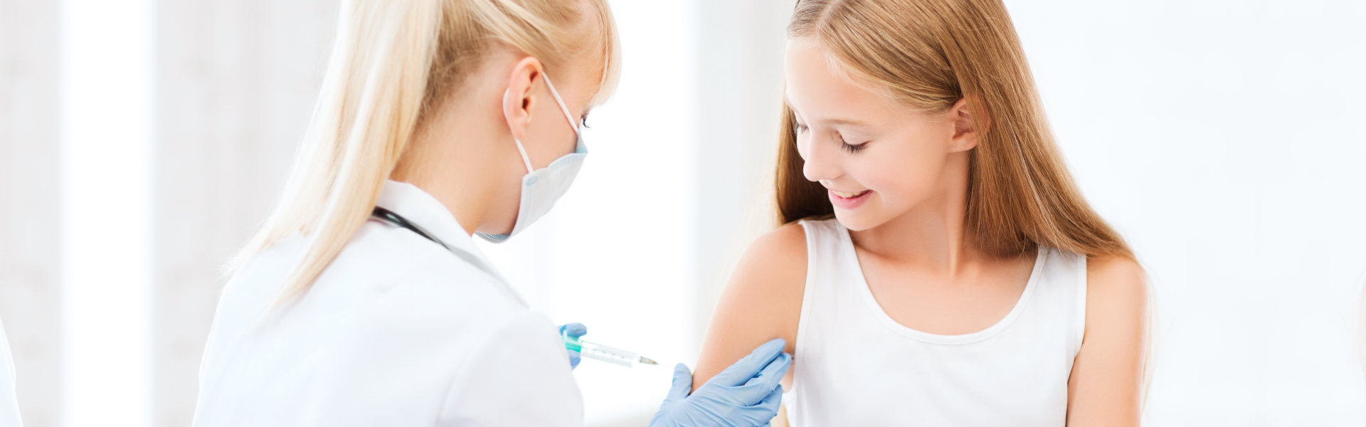 doctor doing vaccine to child